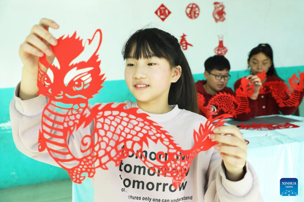 People in China prepare for 2024 Spring FestivalXinhua