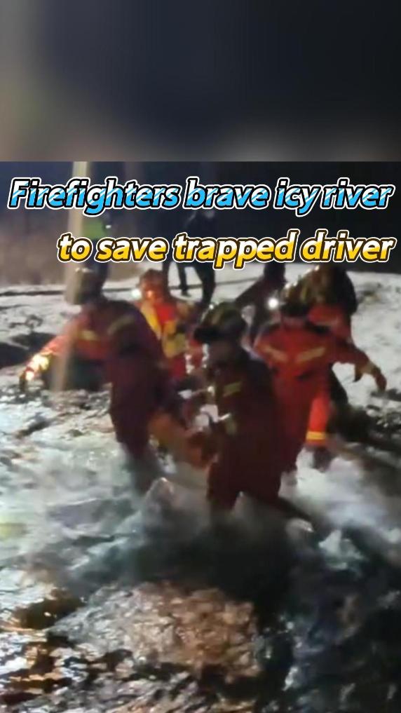 Firefighters brave icy river to save trapped driver