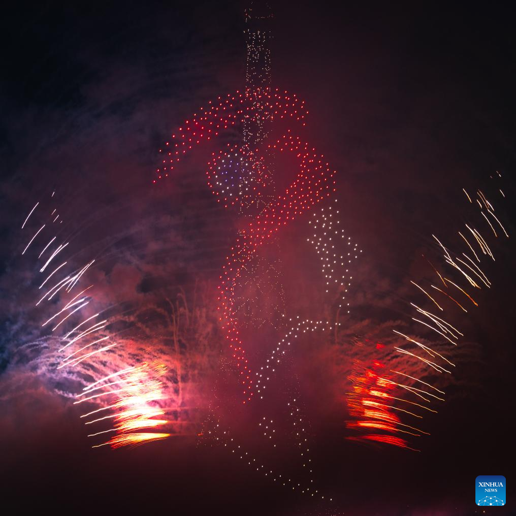 Fireworks explode near Eiffel Tower during Bastille Day celebrationsXinhua